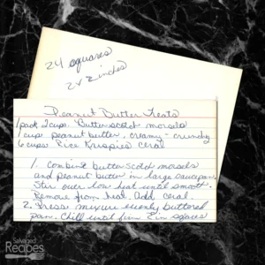 Handwritten recipe cards with recipe for peanut butter squares.